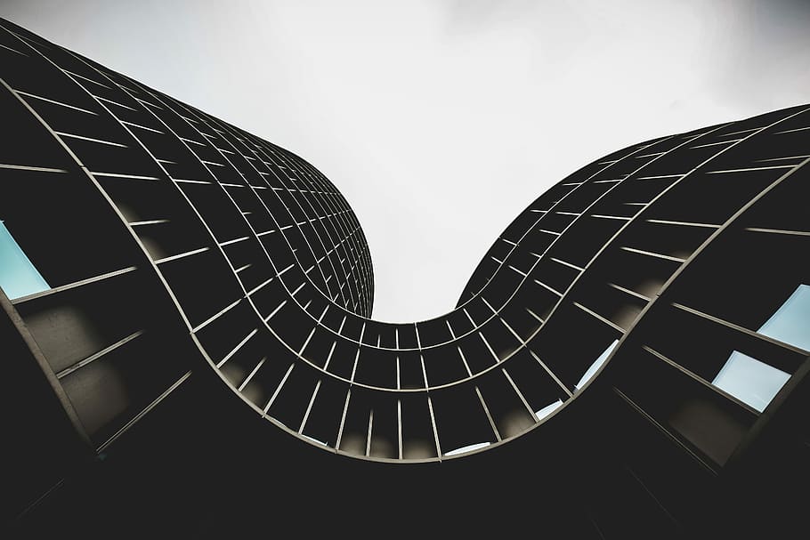 low angle photo of brown concrete building under white sky, worm's eye view of gray concrete building HD wallpaper