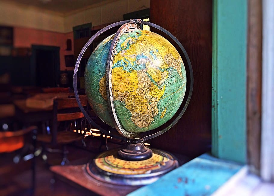 blue and yellow desk globe inside room, world, earth, planet HD wallpaper