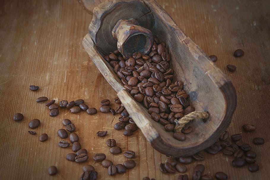 flat lay photography of brown coffee beans on brown table, roasted HD wallpaper