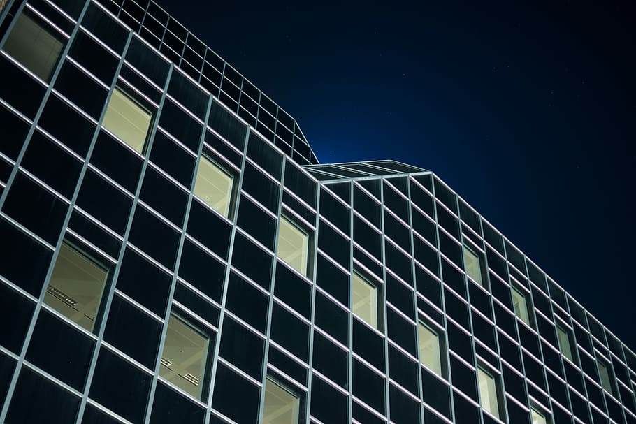 low angle photography of black building during night, low-angle photography of building during nighttime HD wallpaper