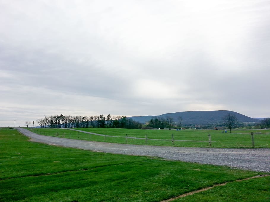 Landscape, clouds, fence, grass, green, mountains, path, road HD wallpaper