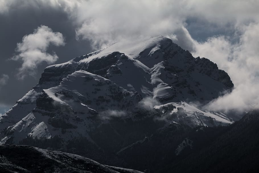 low-angle photography of mountain near clouds, grayscale photo of mountain filled with fogs HD wallpaper
