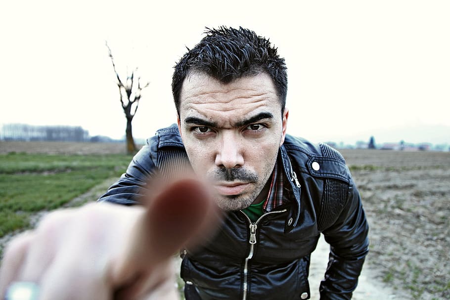 man in black leather zip-up jacket focus photo=, pointing, finger HD wallpaper