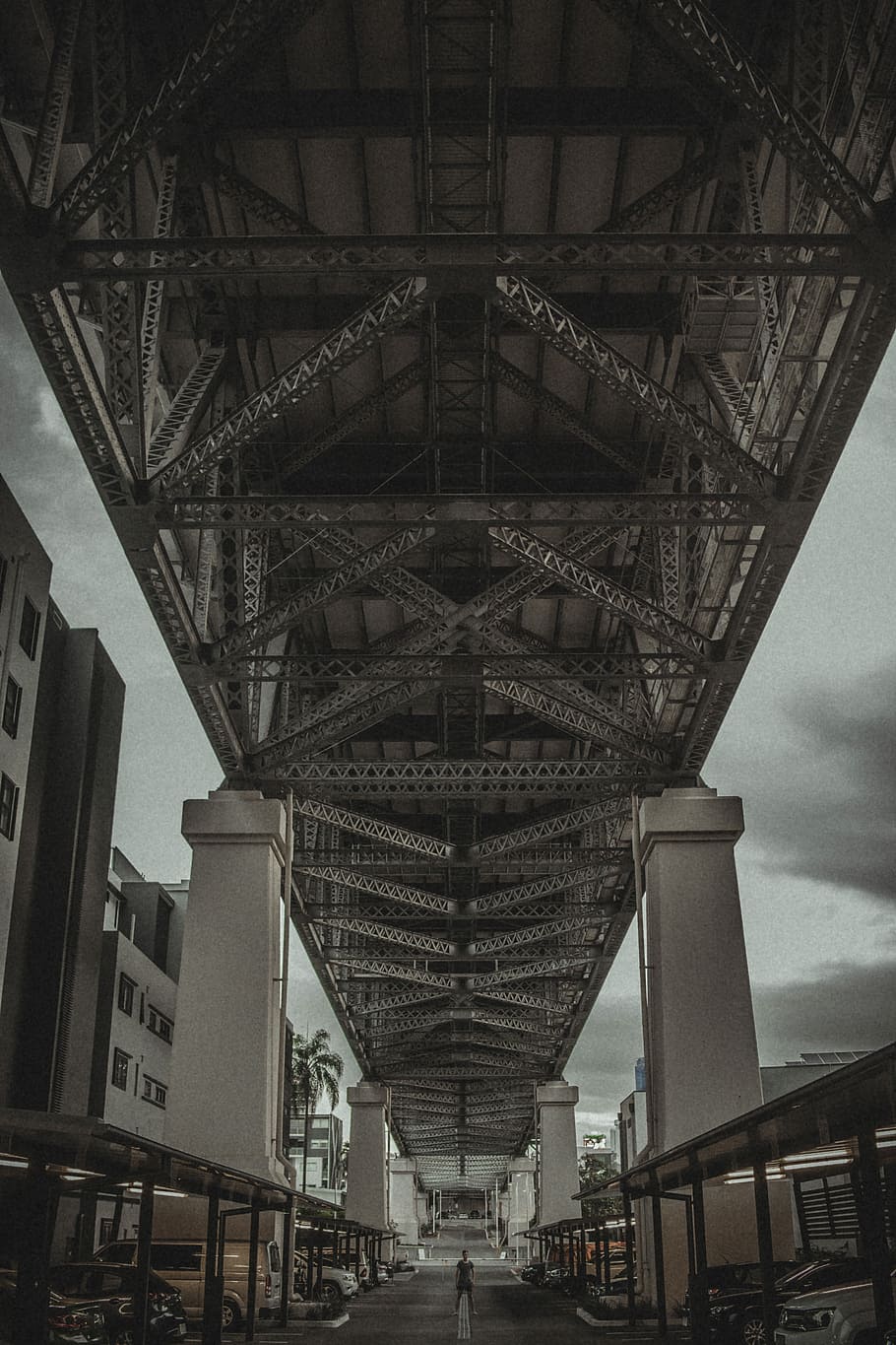 brown metal bridge under cloudy sky, sepia photo of suspension bridge HD wallpaper