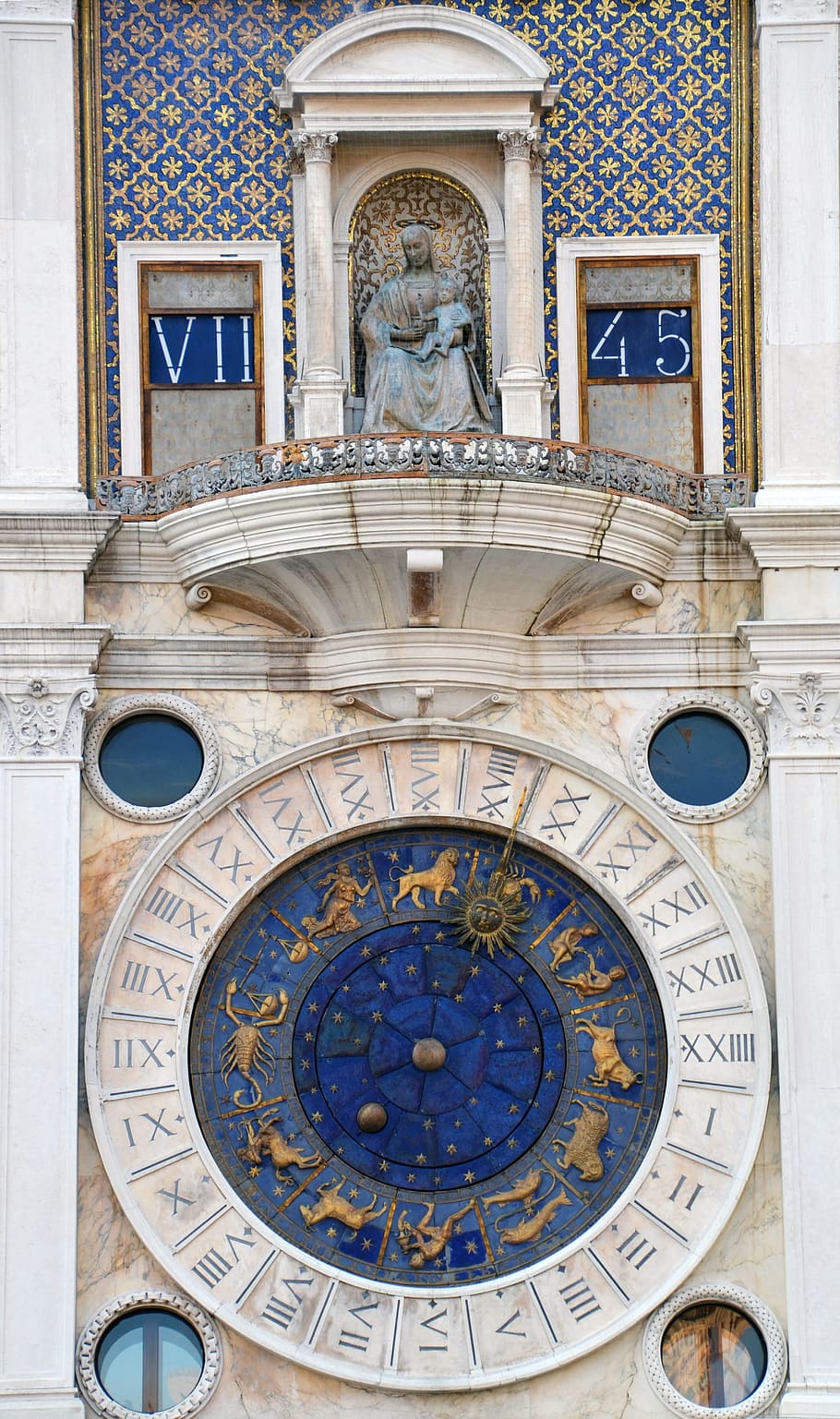 blue and white zodiac sign building, time, clock, astrology, venice