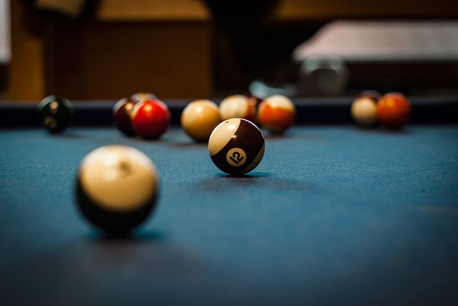 selective focus photography of pool balls on table, pool table