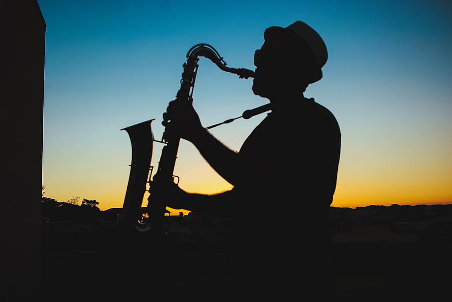 Silhouette of a Man Playing Saxophone during Sunset, adult, backlit, HD wallpaper