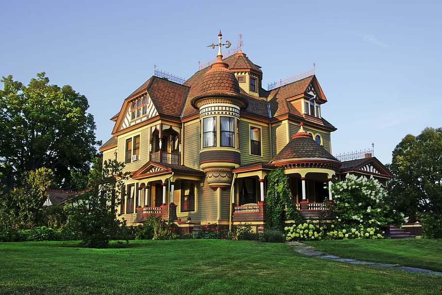 photo of beige and brown mansion, victorian house, painted lady