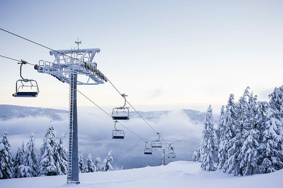 Empty Chair Ski Lift on Bright Winter Day, cold, fog, foggy, forest