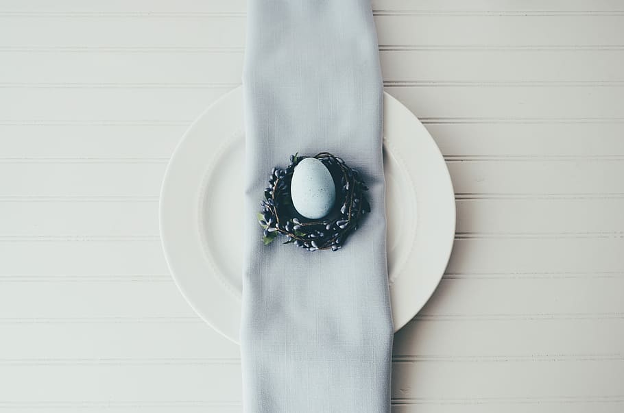 white egg on black plate, white egg in nest decor, indoors, directly above HD wallpaper