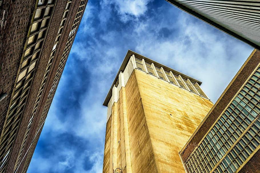 low angle photo of brown and white concrete building, factory HD wallpaper