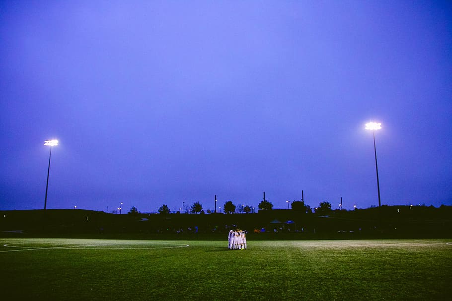 Football team, sports, night, grass, sky, nature, outdoors, dusk HD wallpaper