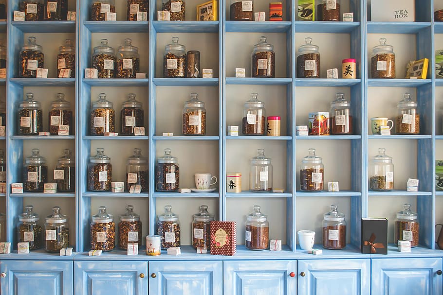 clear glass jars on blue wooden shelves, assorted, rack, tea