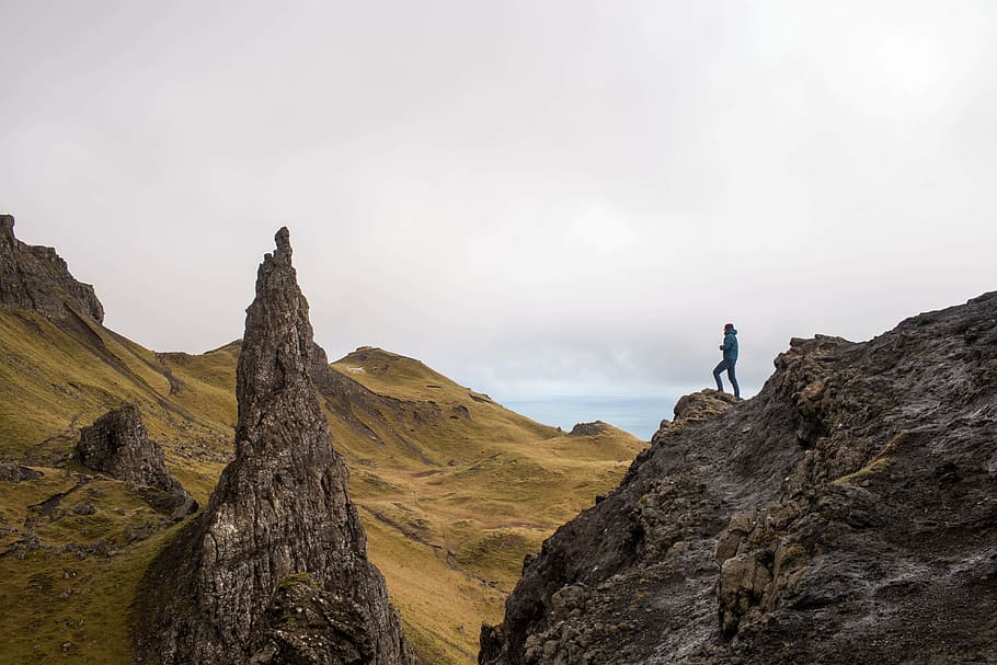 person on mountain peak during daytime, brown, cliff, guy, man HD wallpaper