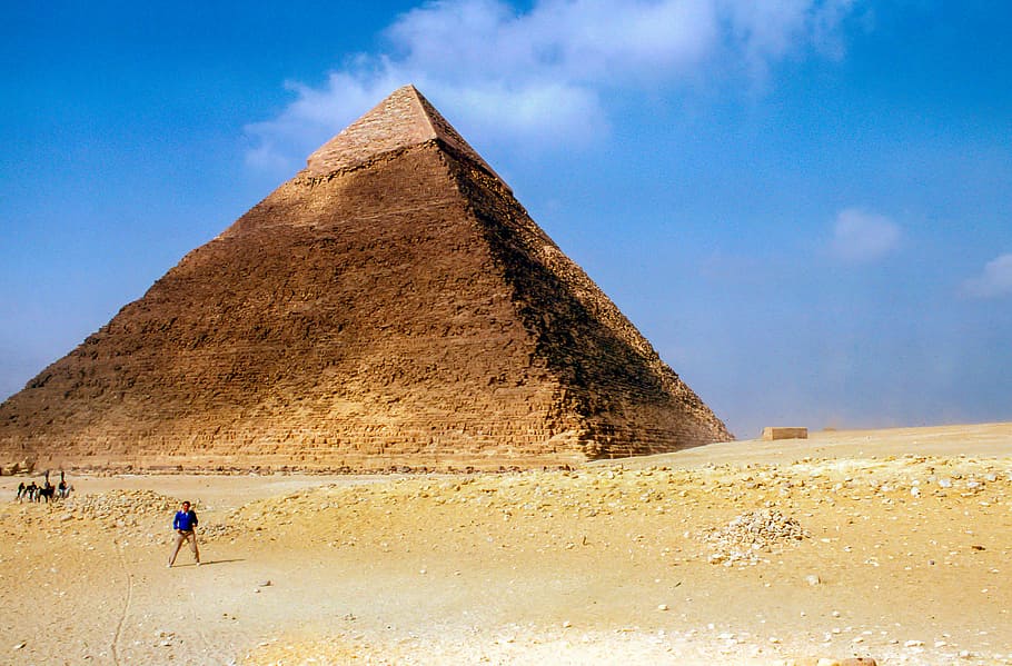 man standing near Pyramid Giza during daytime, Great Pyramid of Giza HD wallpaper