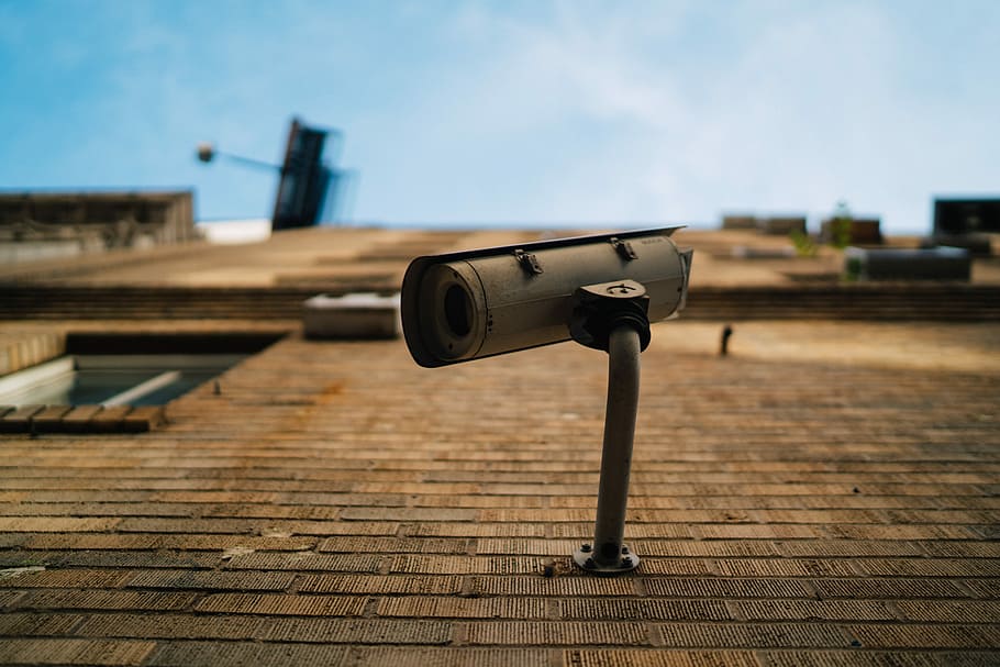 shallow focus photography of gray security camera, white surveillance camera mounted on brown concrete brick wall, HD wallpaper