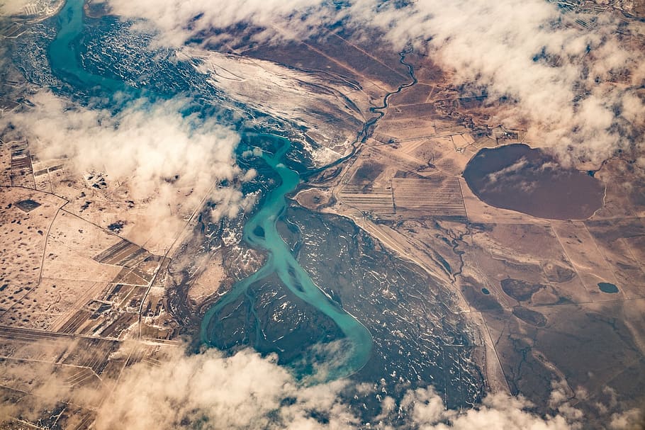 aerial photography of river between brown terrains, aerial view HD wallpaper