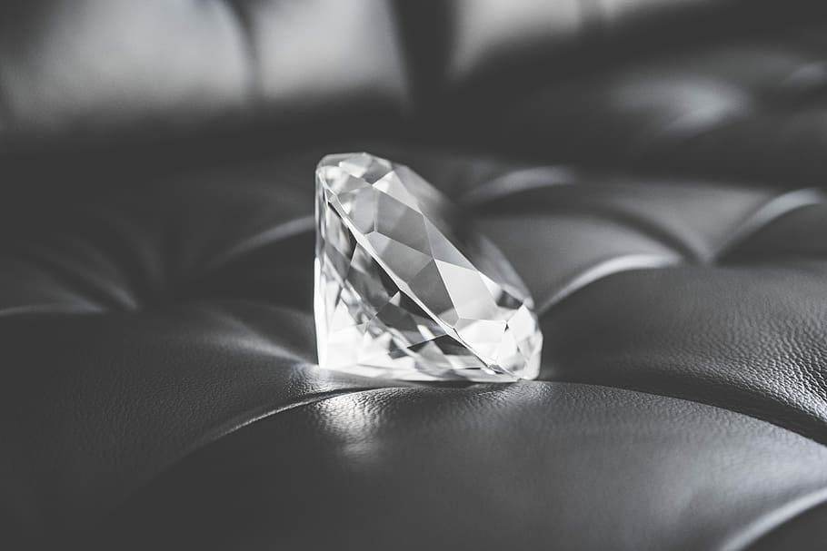 Big Glass Diamond Crystal on Black Leather Sofa, all black, black and white