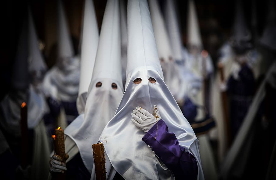 Spanish Holy Week Procession, shallow focus photography of white masks HD wallpaper
