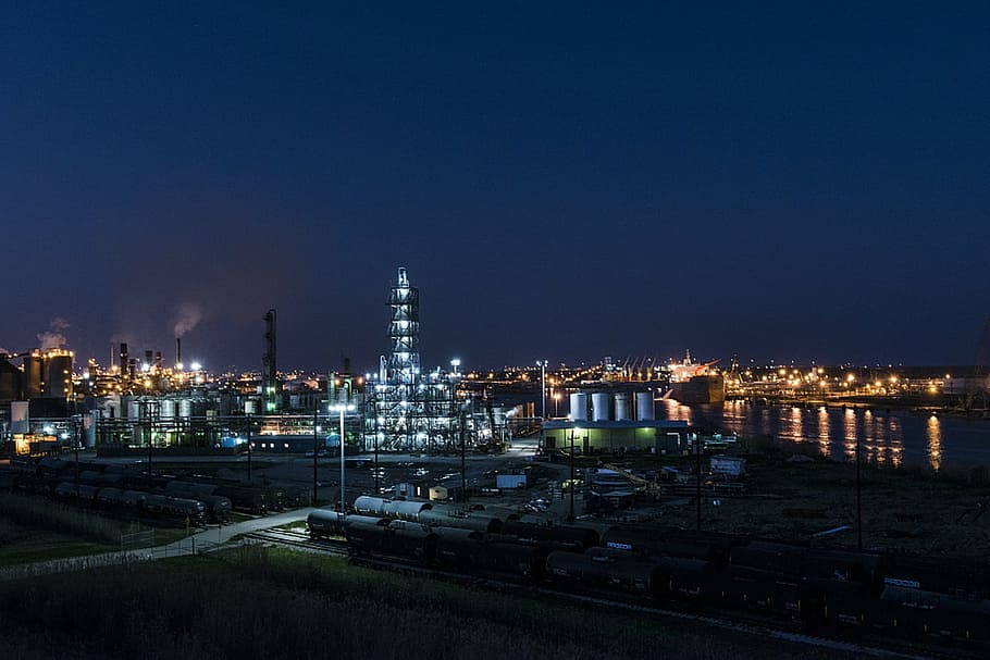 aerial photography of lighted buildings at night time, industrial