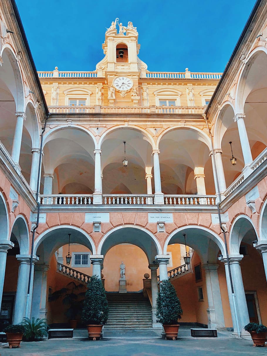 Genova, beige painted building taken under clear sky during daytime HD wallpaper