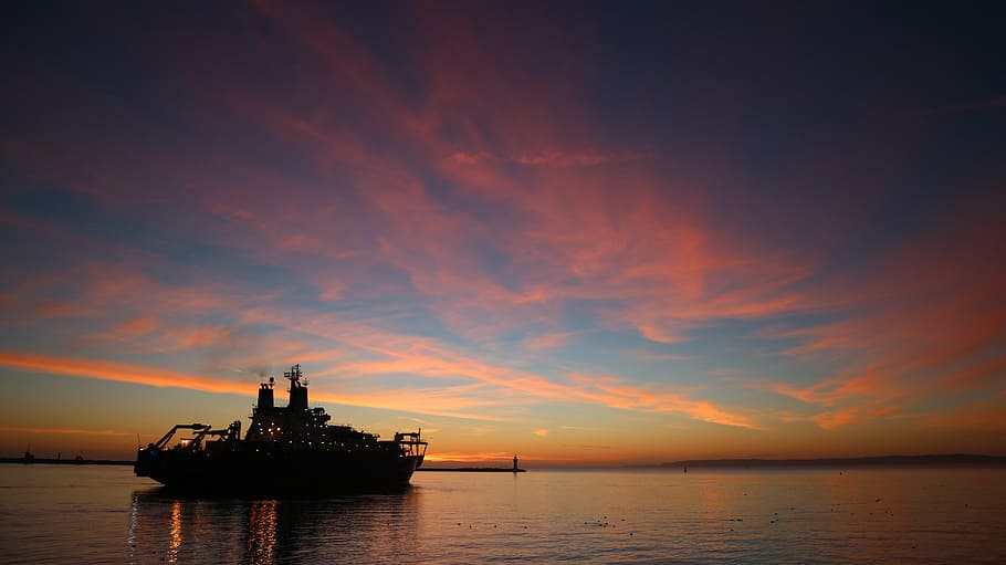 silhouette of island, ship, sea, horizon, water, sunset, seafaring