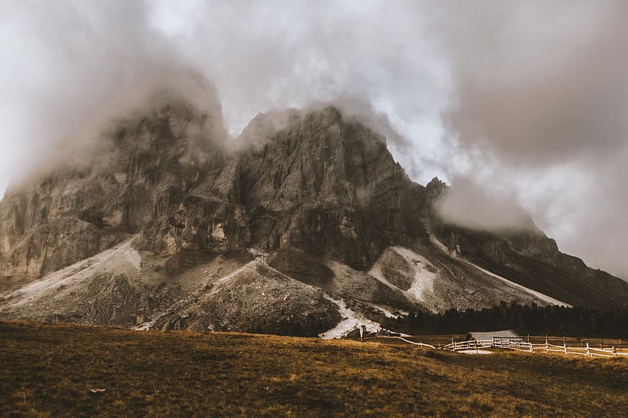 brown rocky mountain covering with fogs, mountains with fog during daytime HD wallpaper