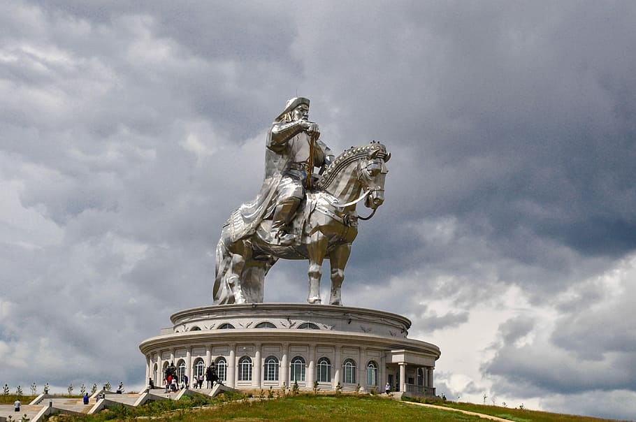 statue of man riding horse on top of building, History, Tourism