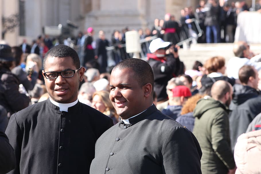 two men standing beside people, priest, human, young, group of people HD wallpaper