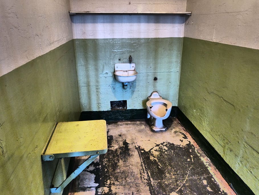 white ceramic toilet bowl near wall shelf, alcatraz, alcatraz prison