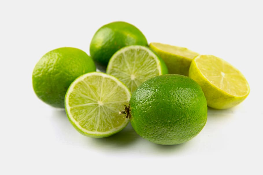 Fresh lime fruits sitting on a plain white background, image captured with a Canon 6D, HD wallpaper