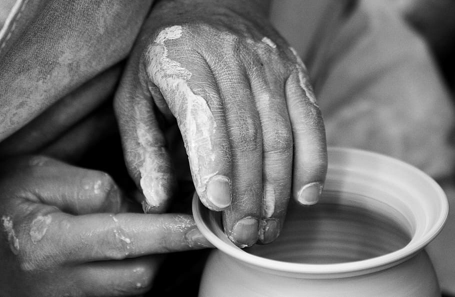 grayscale photo of person's hands molding pot, picture, clay pot