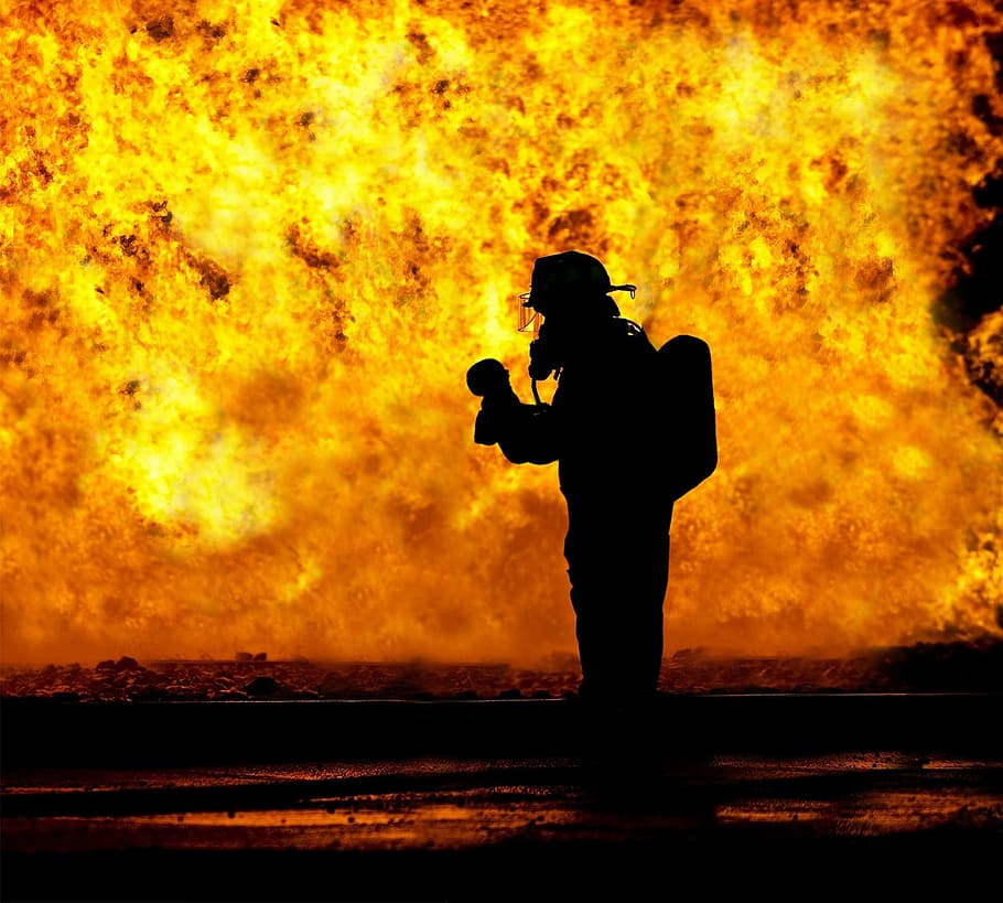 silhouette of man, fire fighter, rescue, baby, held, hard, inferno