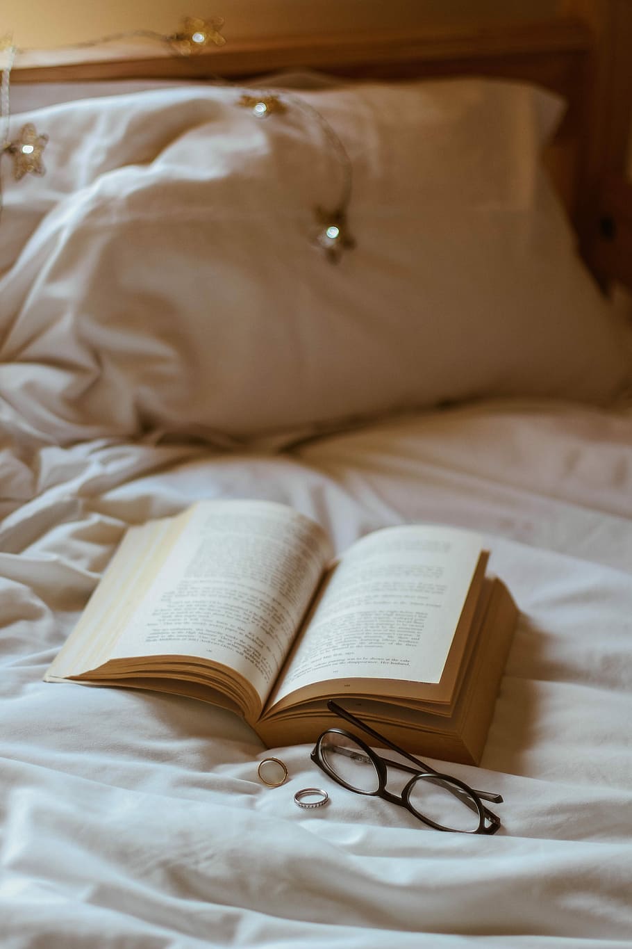 eyeglasses beside book and rings, eyeglasses with black frames HD wallpaper