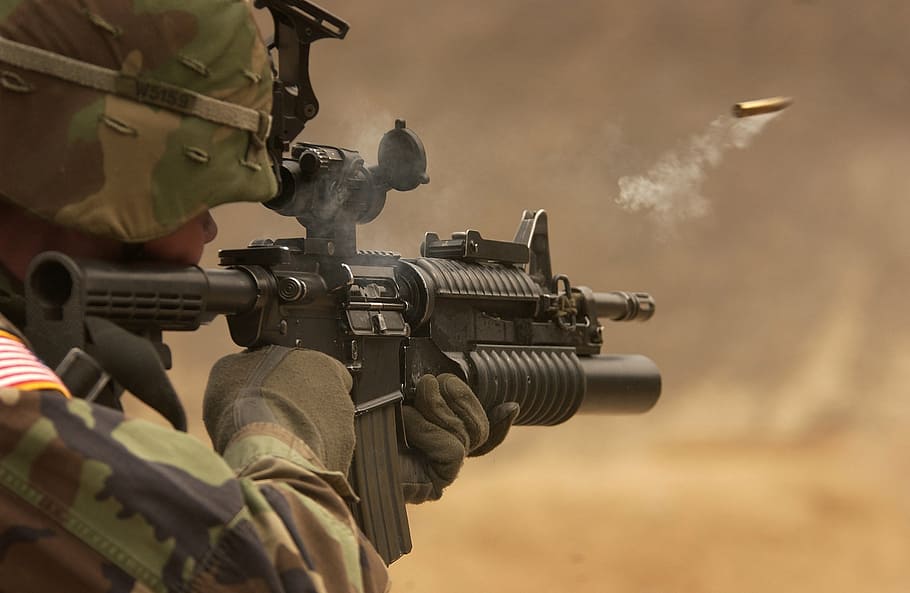 soldier firing M4 rifle, submachine gun, automatic weapon, shoot