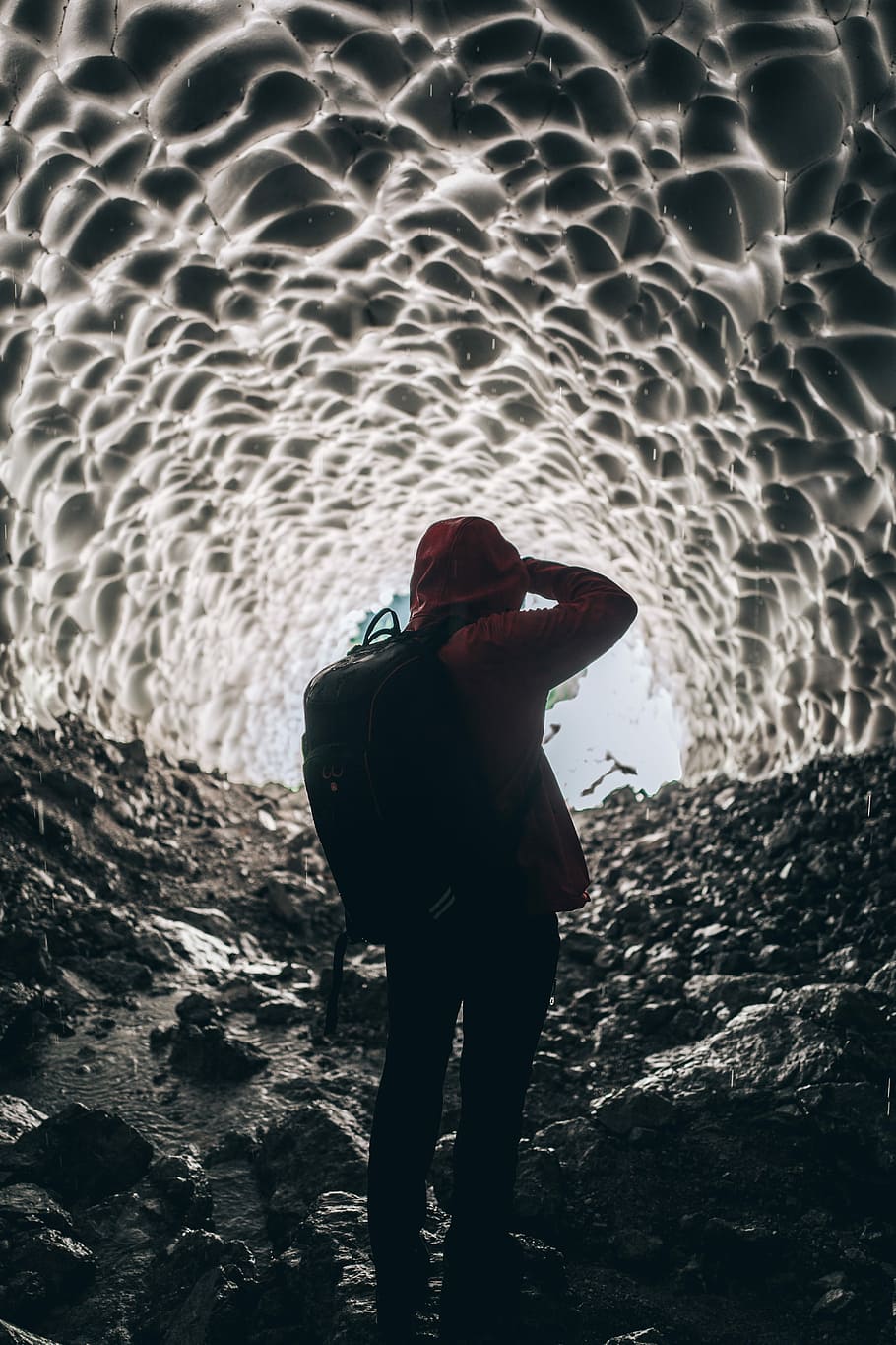 person wearing backpack inside cave, person inside cave during daytime HD wallpaper