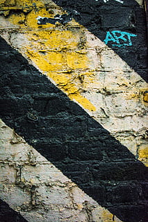 black and white paint on wall, gray concrete wall with art, black, yellow HD wallpaper