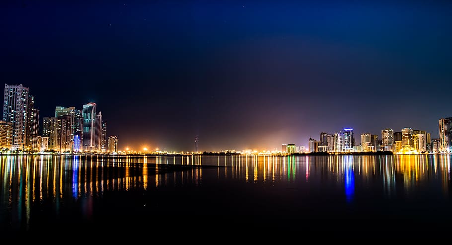 panoramic photography of lighted cityscape across body of water during nighttime, HD wallpaper