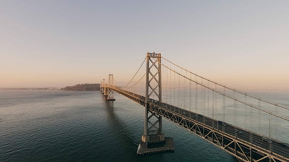 body of water under brown bridge under white sky, golden Gate Bridge HD wallpaper