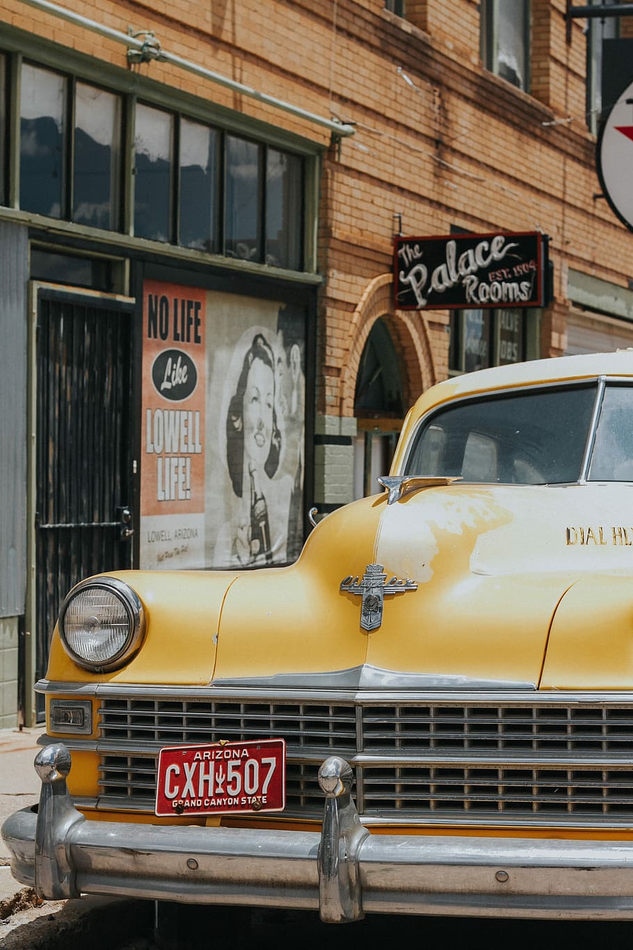 yellow vehicle parked next to building, yellow car parking in The Palace Rooms HD wallpaper