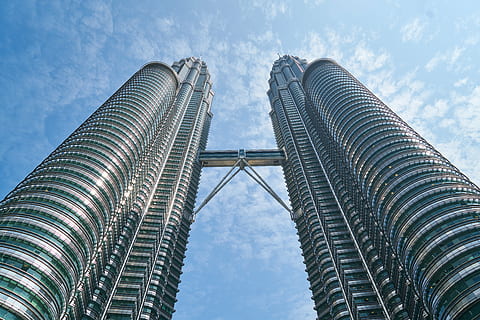 low angle photo of Petronas Tower, Malaysia under blue sky HD wallpaper