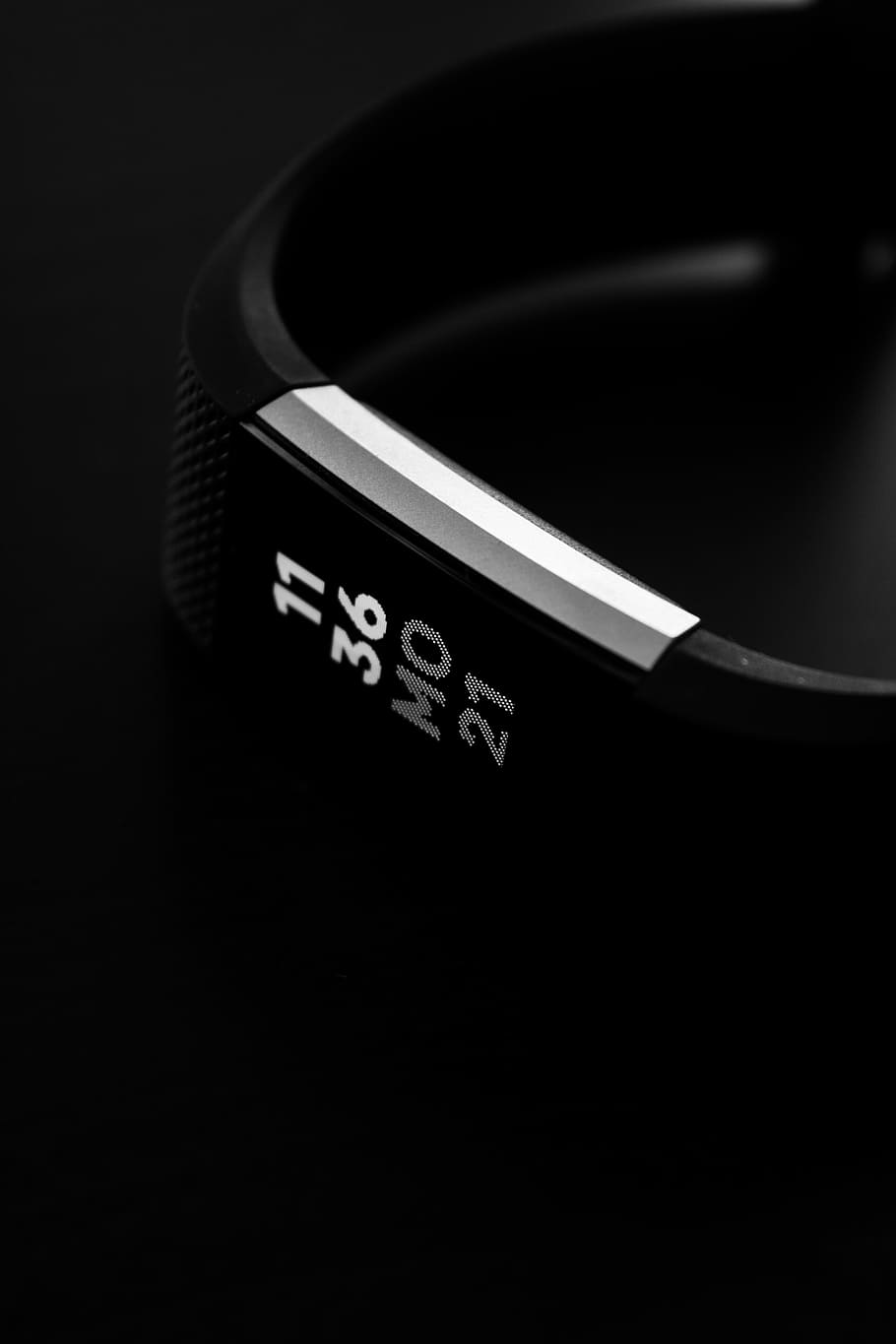 activity tracker reading 11 36 Mo 21, selective focus photography of Fitbit Alta