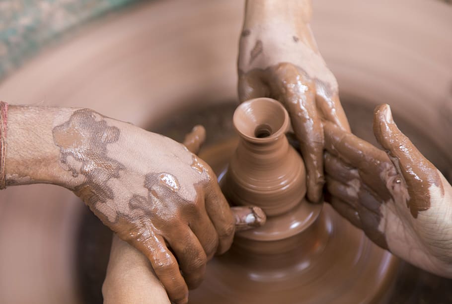 two people making pottery, clay, artist, working, wheel, craft
