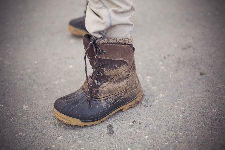person wearing brown boot, person wearing black and brown leather duck boot on left foot HD wallpaper