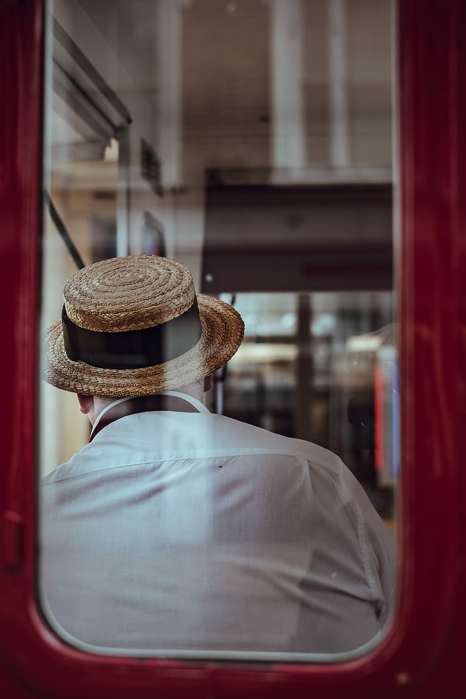 man sitting on chair inside train during day time, man wearing white shirt and beige straw hat sitting in in vehicle HD wallpaper