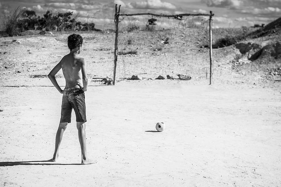 man standing in front of goal net beside soccer ball, people HD wallpaper