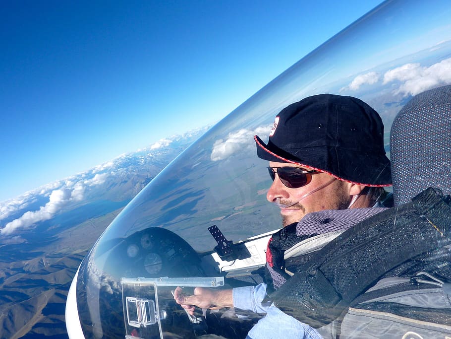 man in black bucket hat driving plane during daytime, pilot HD wallpaper