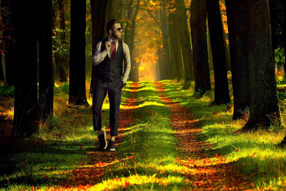 man wearing black vest and white dress shirt walking during daytime HD wallpaper