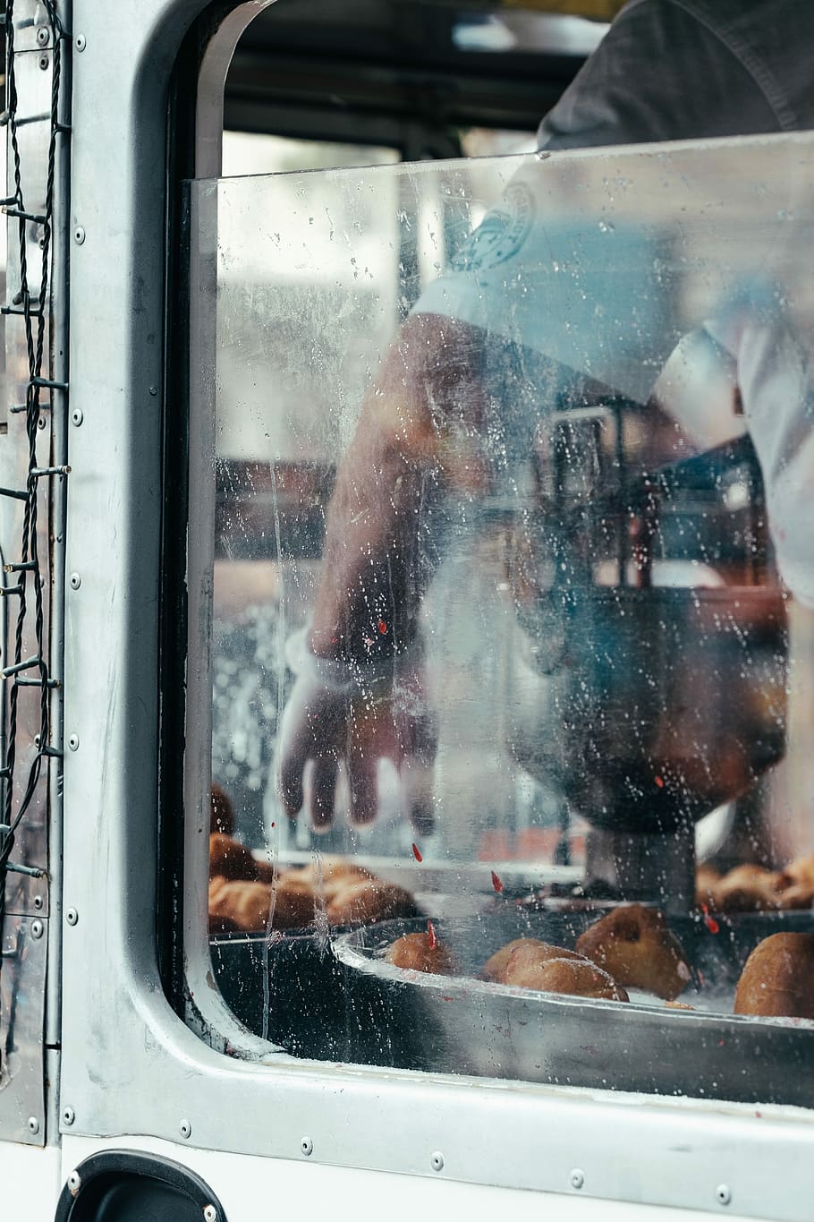 person cooking dish, person inside vehicle during daytime, window HD wallpaper