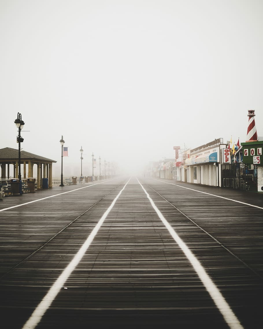 pathway between gazebo and stores surrounded by fogs, gray wooden pier with shops HD wallpaper